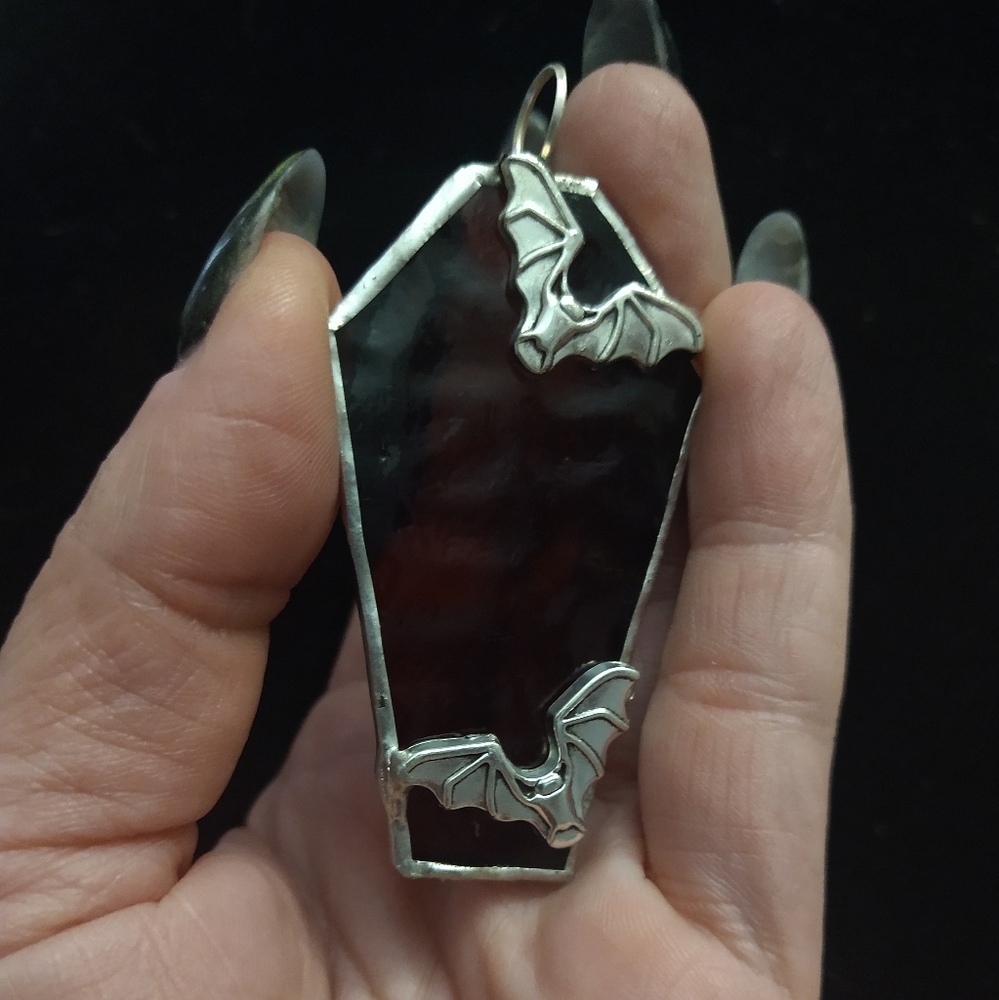 Stained glass coffin pendant with bats